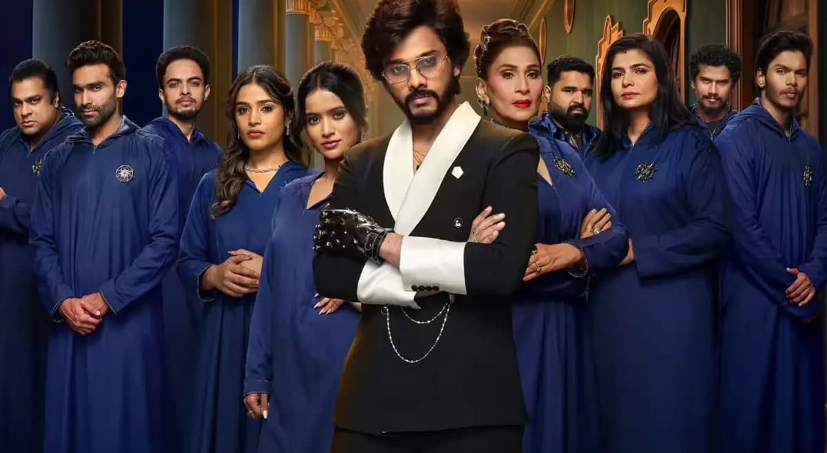 A tense moment from The Traitors Telugu, contestants gathered in a circle, faces lit by dim light, eyes locked in suspicion.