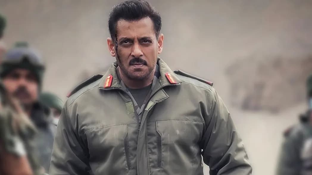 Salman Khan in a military uniform, standing in front of a mountain range