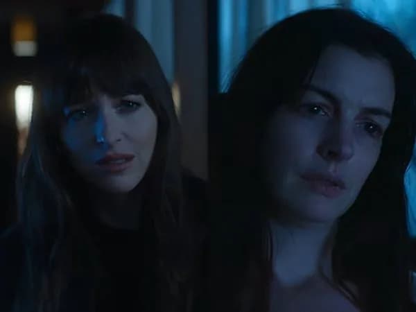 Anne Hathaway and Dakota Johnson locked in a heated stare in Verity’s new promotional clip